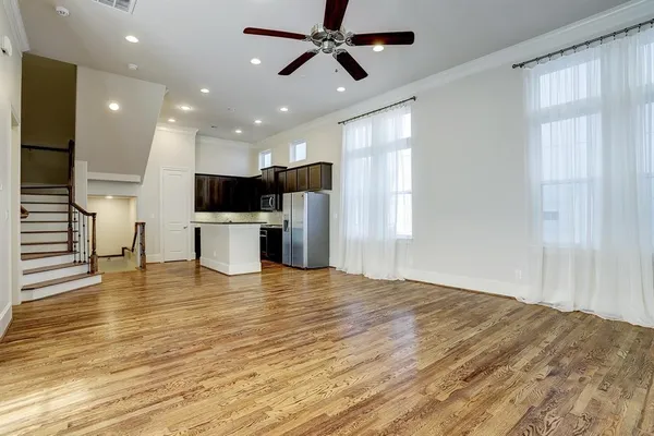 a view of kitchen with sink microwave and refrigerator