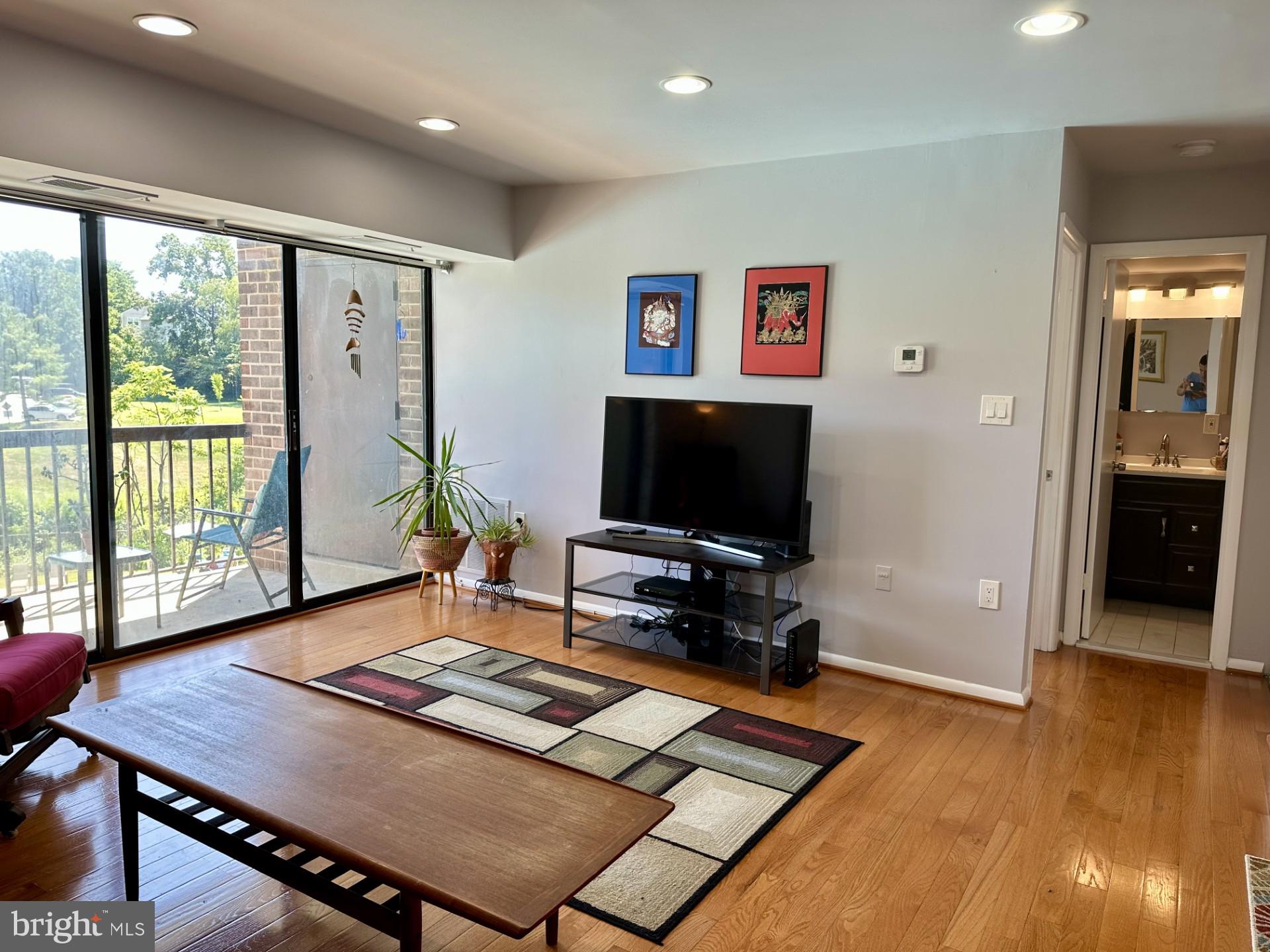15702 Dorset Road, Unit 135 Laurel, MD 20707 - Photo 12 of 26 Living room with sliders to balcony