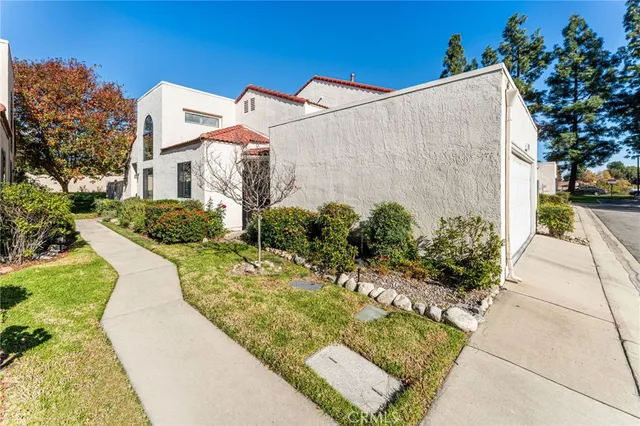a view of a backyard with potted plants