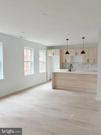 a large white bed in a white room