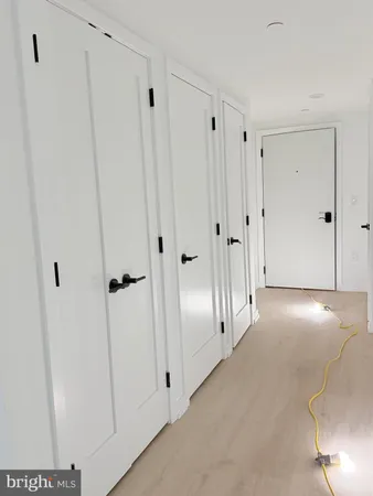 a view of a hallway with closet area