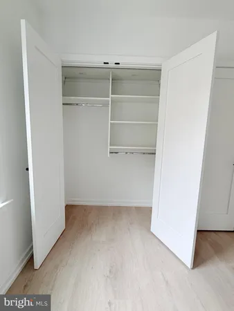 a view of an empty walk in closet