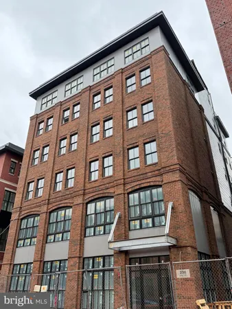 a front view of a building with a lot of windows