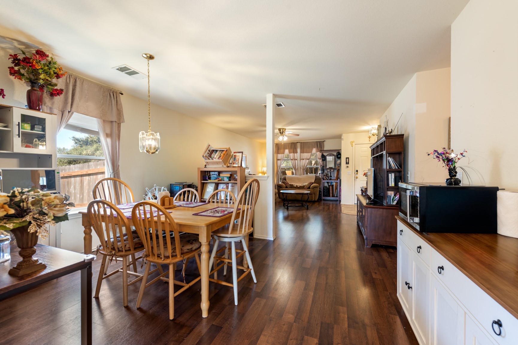 5501 English Avenue Austin, TX 78724 - Photo 6 of 19 a view of a dining room with furniture and wooden floor