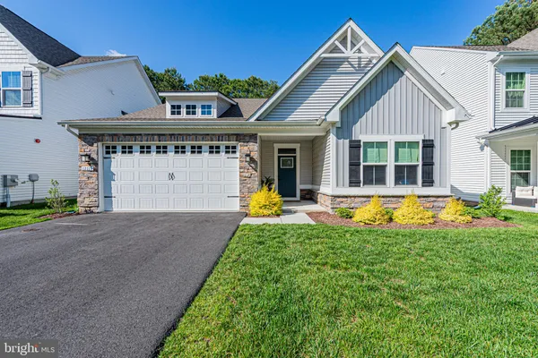 a view of a house with swimming pool and a yard