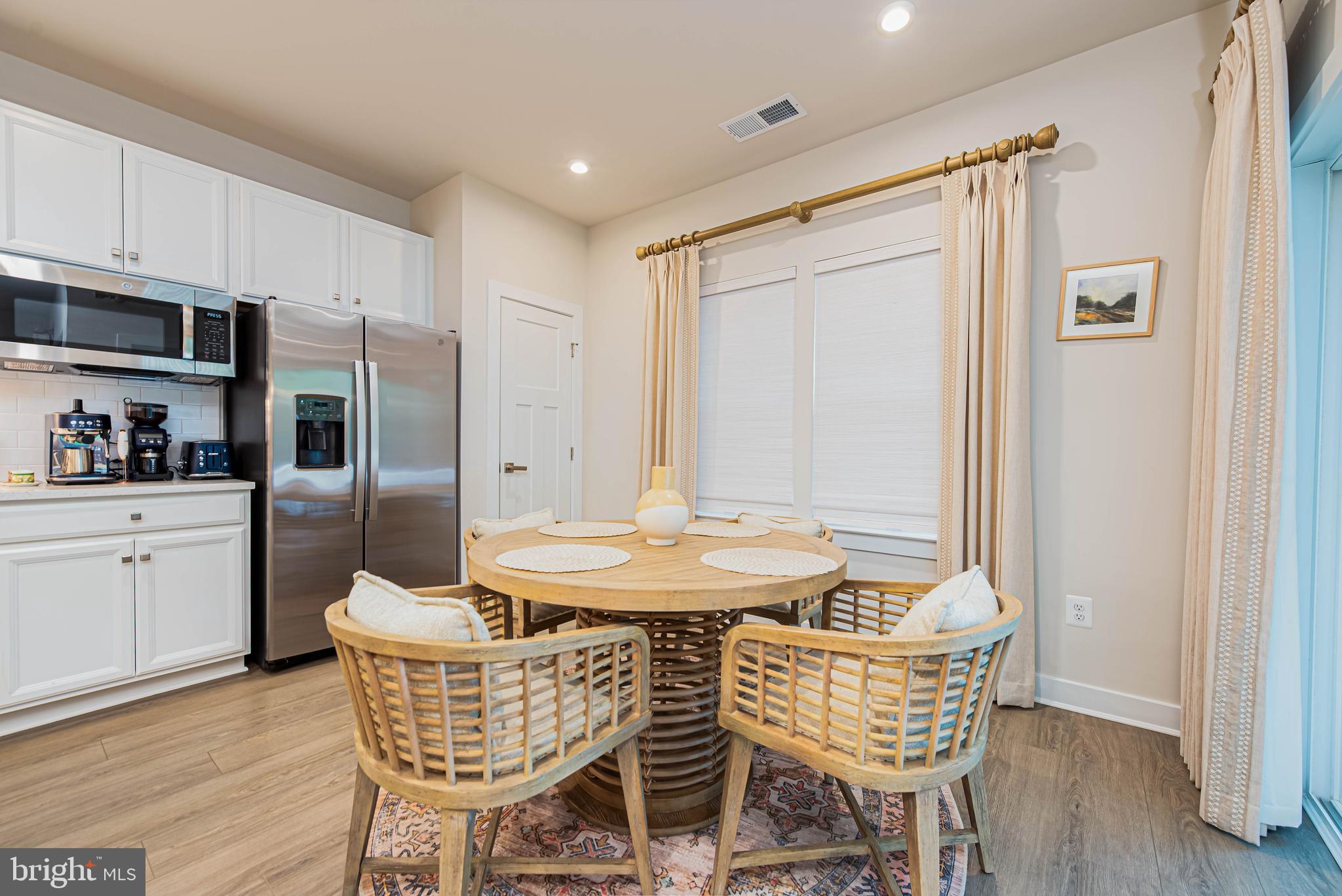 12115 Snug Harbor Road Berlin, MD 21811 - Photo 11 of 46 a dining room with furniture and wooden floor