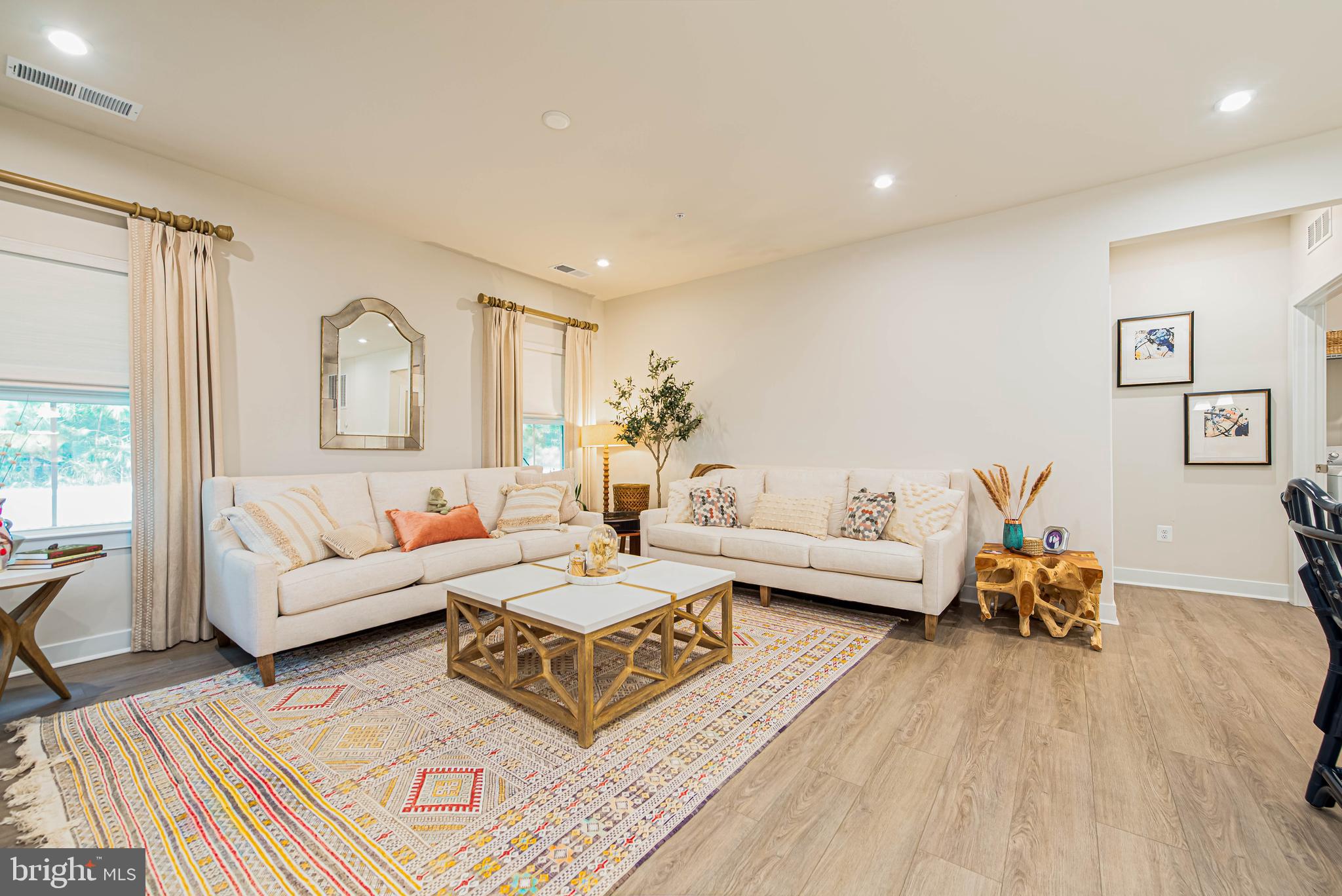 12115 Snug Harbor Road Berlin, MD 21811 - Photo 12 of 46 a living room with furniture and a wooden floor