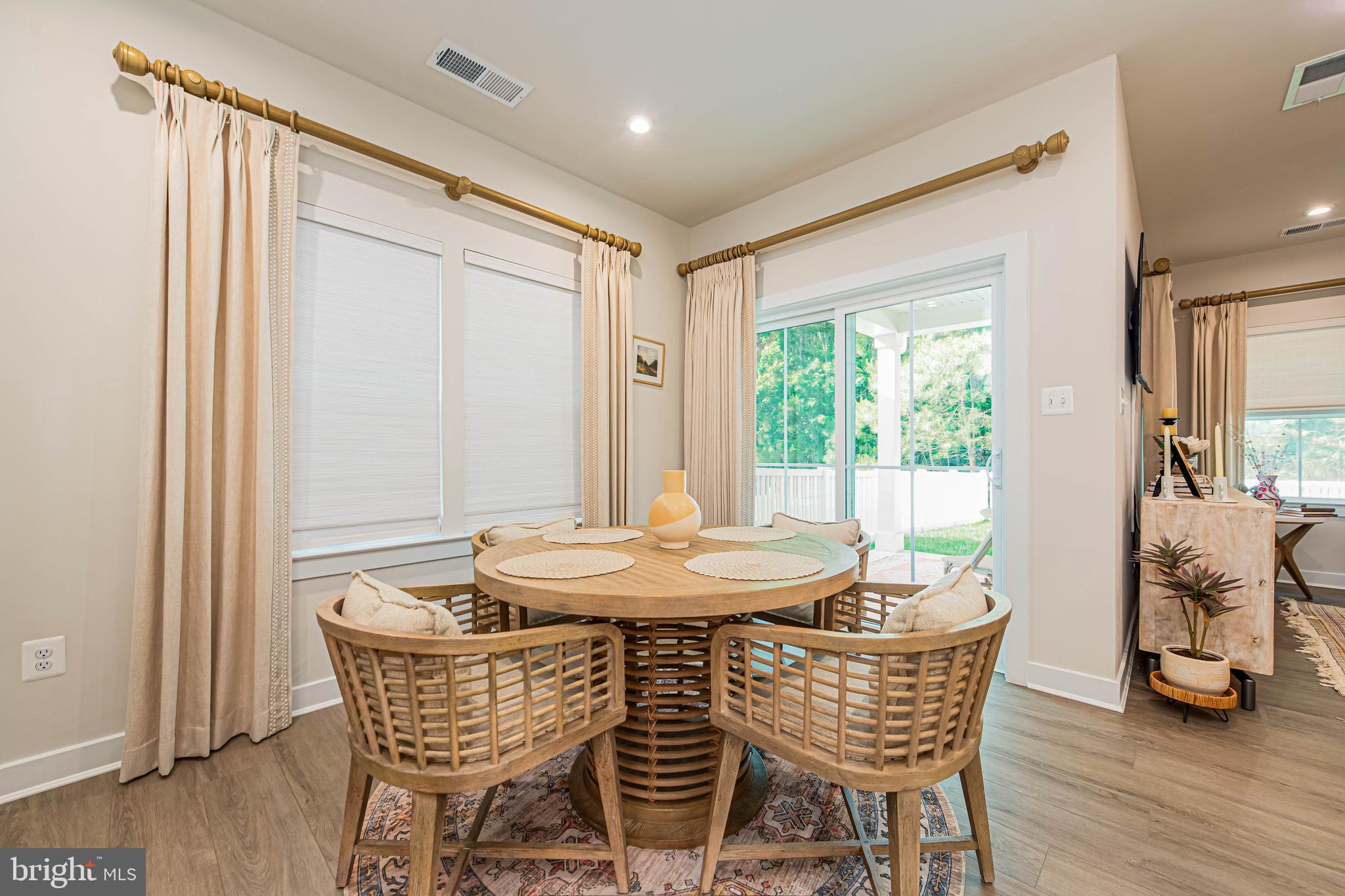 12115 Snug Harbor Road Berlin, MD 21811 - Photo 14 of 46 a dining room with furniture window and wooden floor