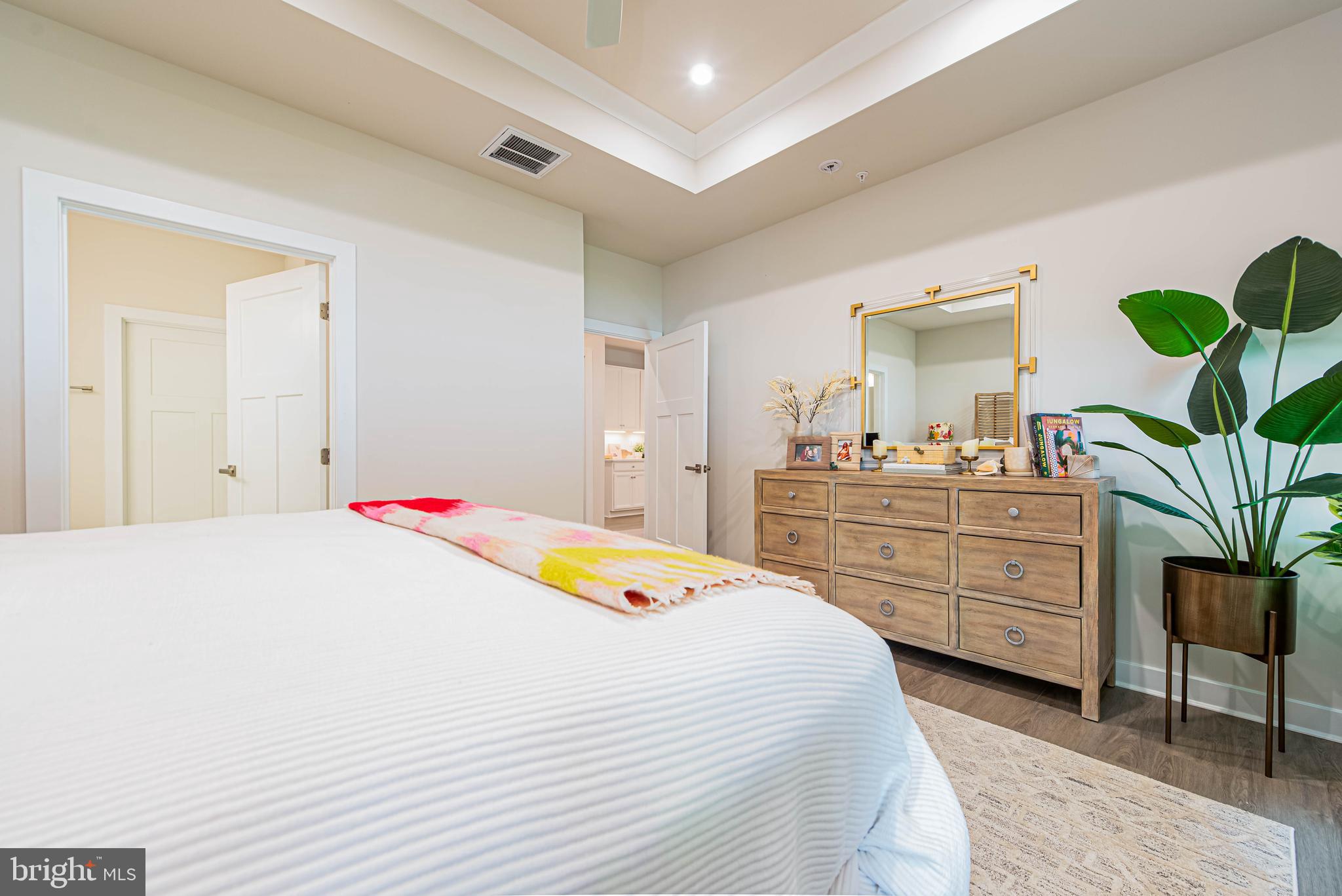 12115 Snug Harbor Road Berlin, MD 21811 - Photo 16 of 46 a bedroom with a bed and a dresser