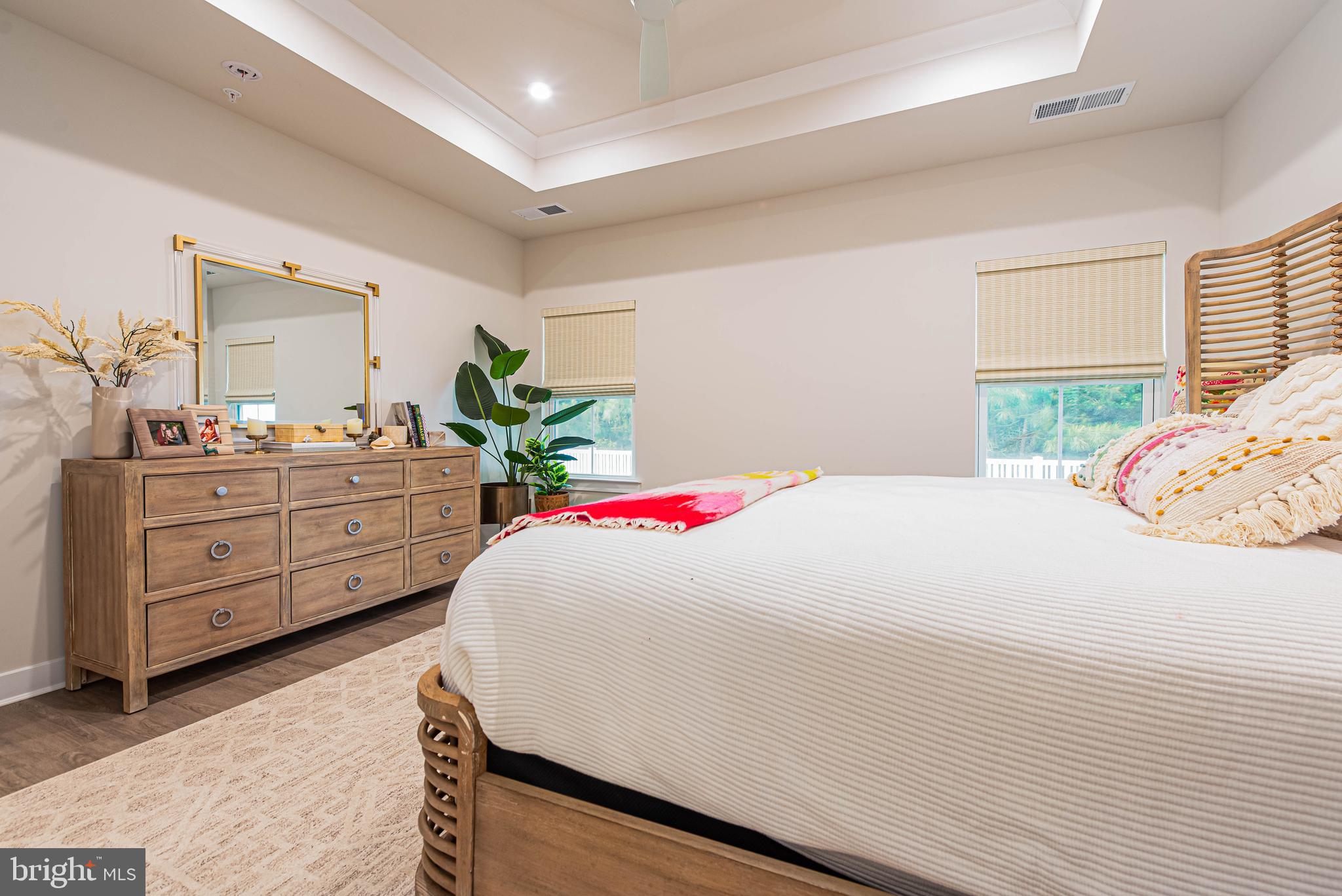 12115 Snug Harbor Road Berlin, MD 21811 - Photo 17 of 46 a bedroom with a bed and a dresser