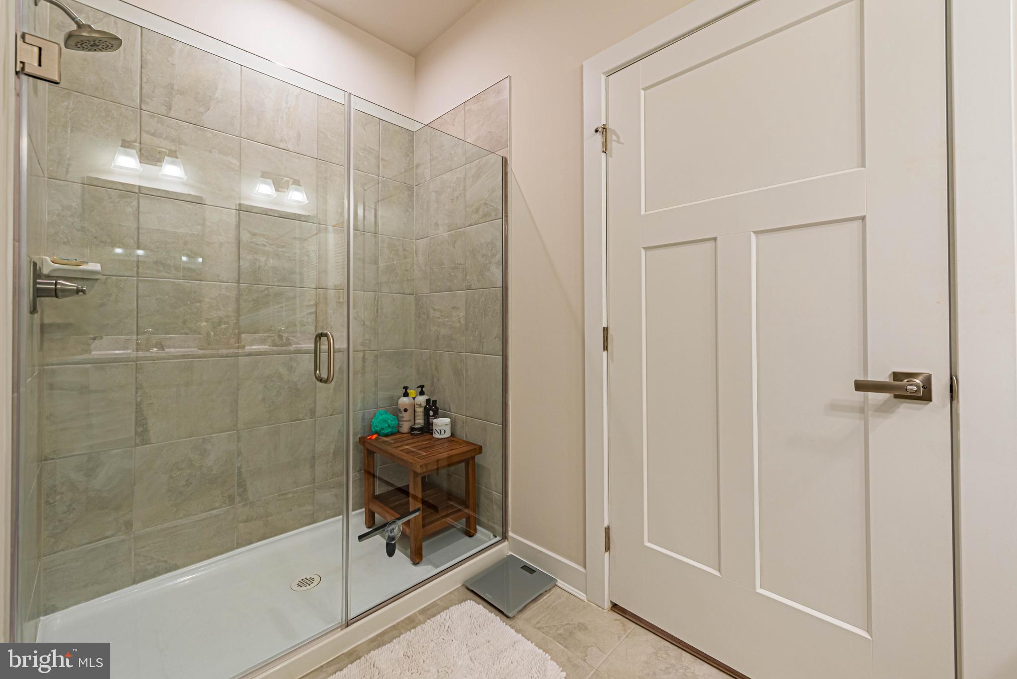 12115 Snug Harbor Road Berlin, MD 21811 - Photo 19 of 46 a bathroom with a shower and a sink