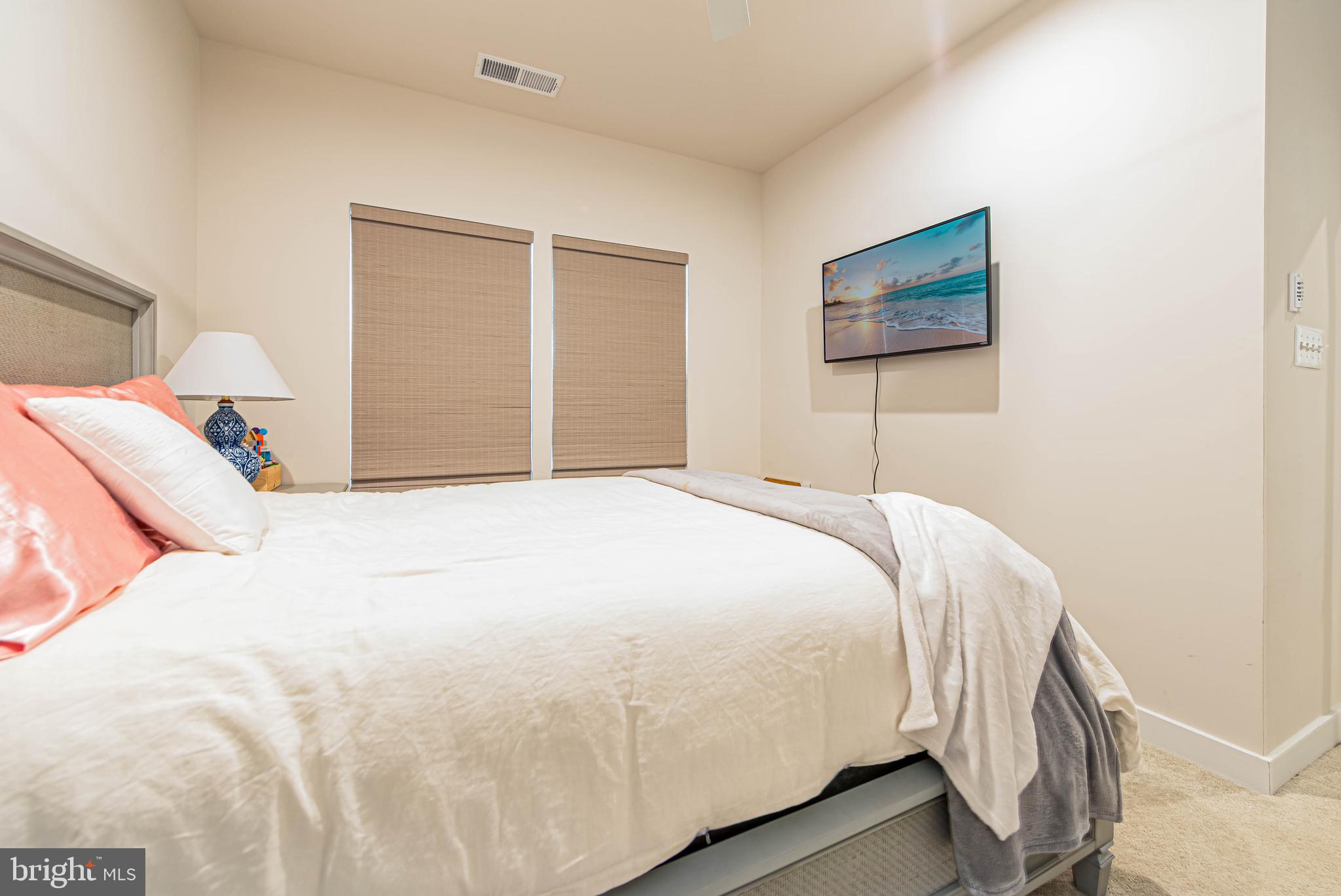 12115 Snug Harbor Road Berlin, MD 21811 - Photo 24 of 46 a bedroom with a bed and a painting on the wall