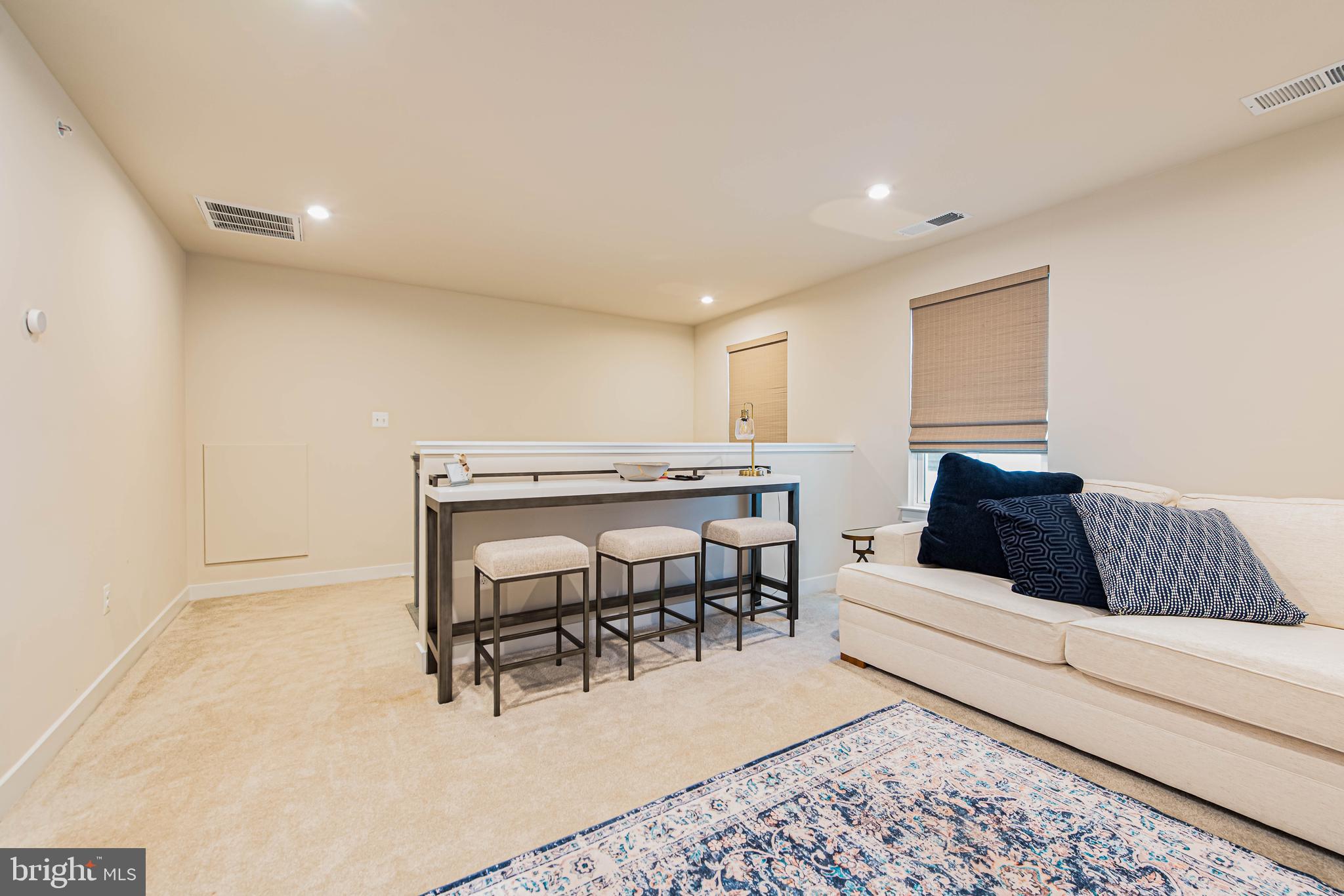 12115 Snug Harbor Road Berlin, MD 21811 - Photo 29 of 46 a living room with furniture and a table