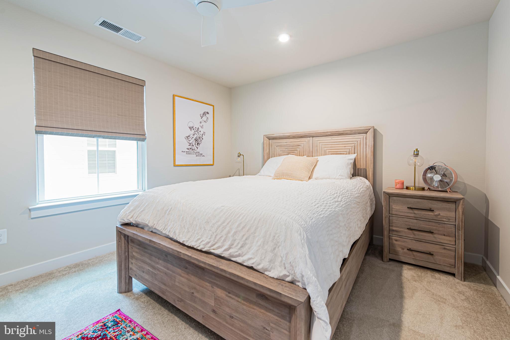 12115 Snug Harbor Road Berlin, MD 21811 - Photo 31 of 46 a bedroom with a bed and a dresser