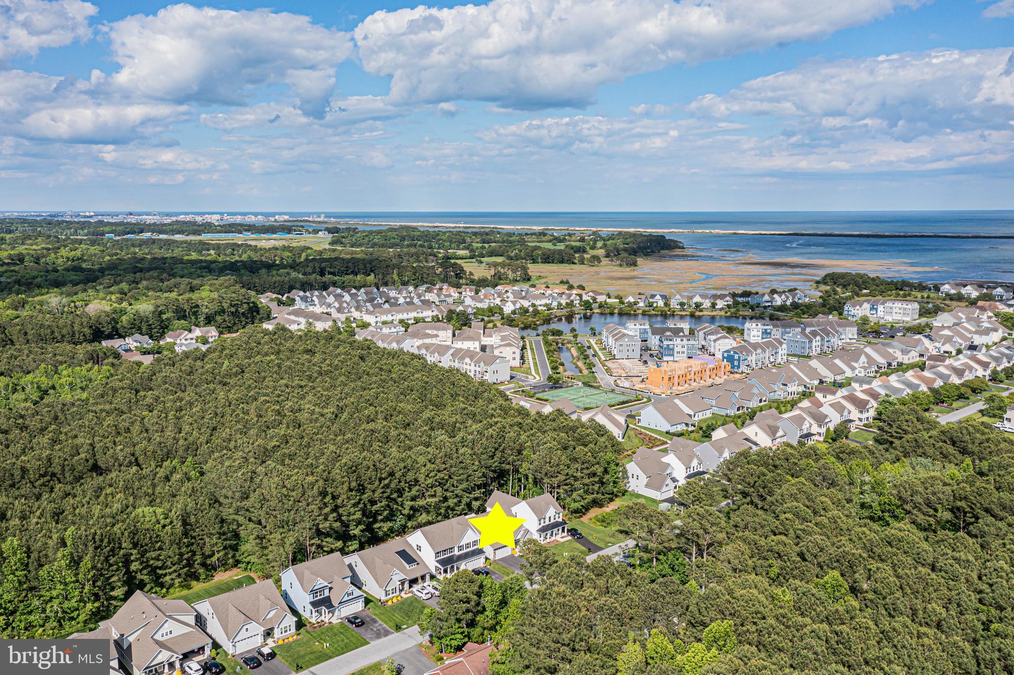 12115 Snug Harbor Road Berlin, MD 21811 - Photo 34 of 46 a view of a lake with a building in the back