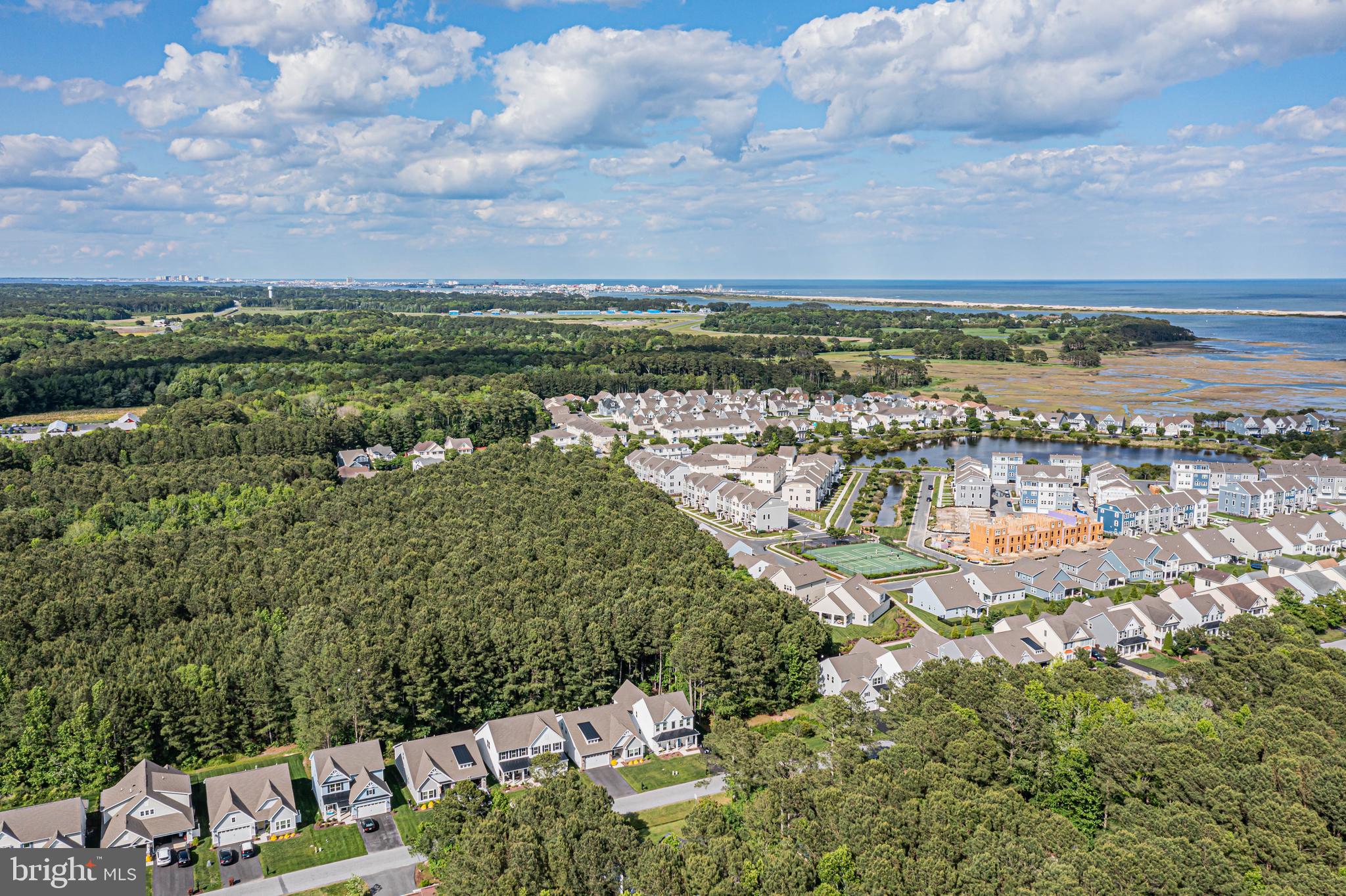 12115 Snug Harbor Road Berlin, MD 21811 - Photo 35 of 46 a view of a lake with houses in the back