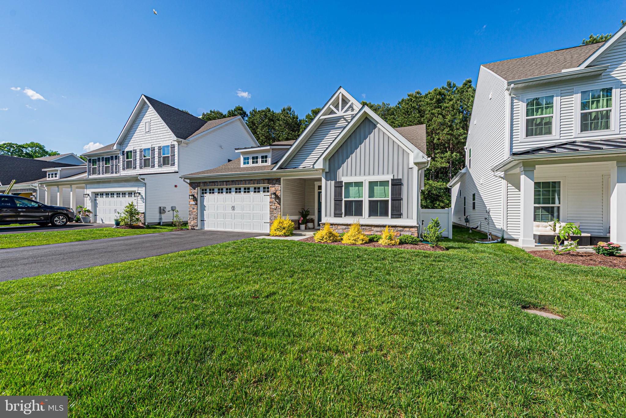 12115 Snug Harbor Road Berlin, MD 21811 - Photo 37 of 46 a view of a house with a big yard and large trees