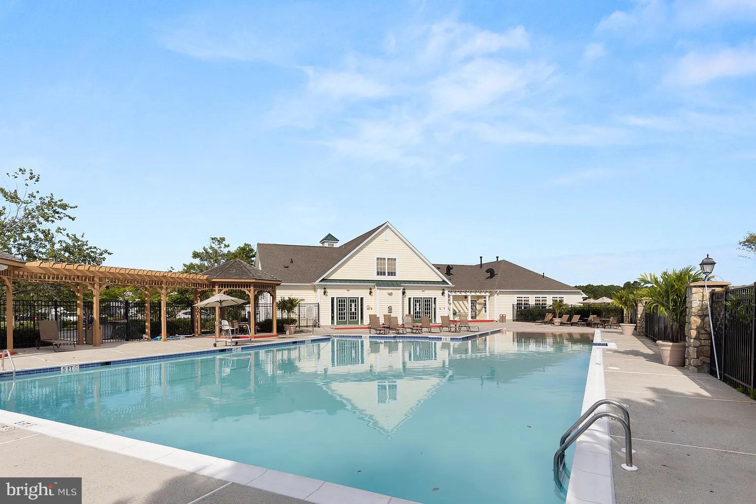 12115 Snug Harbor Road Berlin, MD 21811 - Photo 42 of 46 a view of a house next to a lake with a big yard