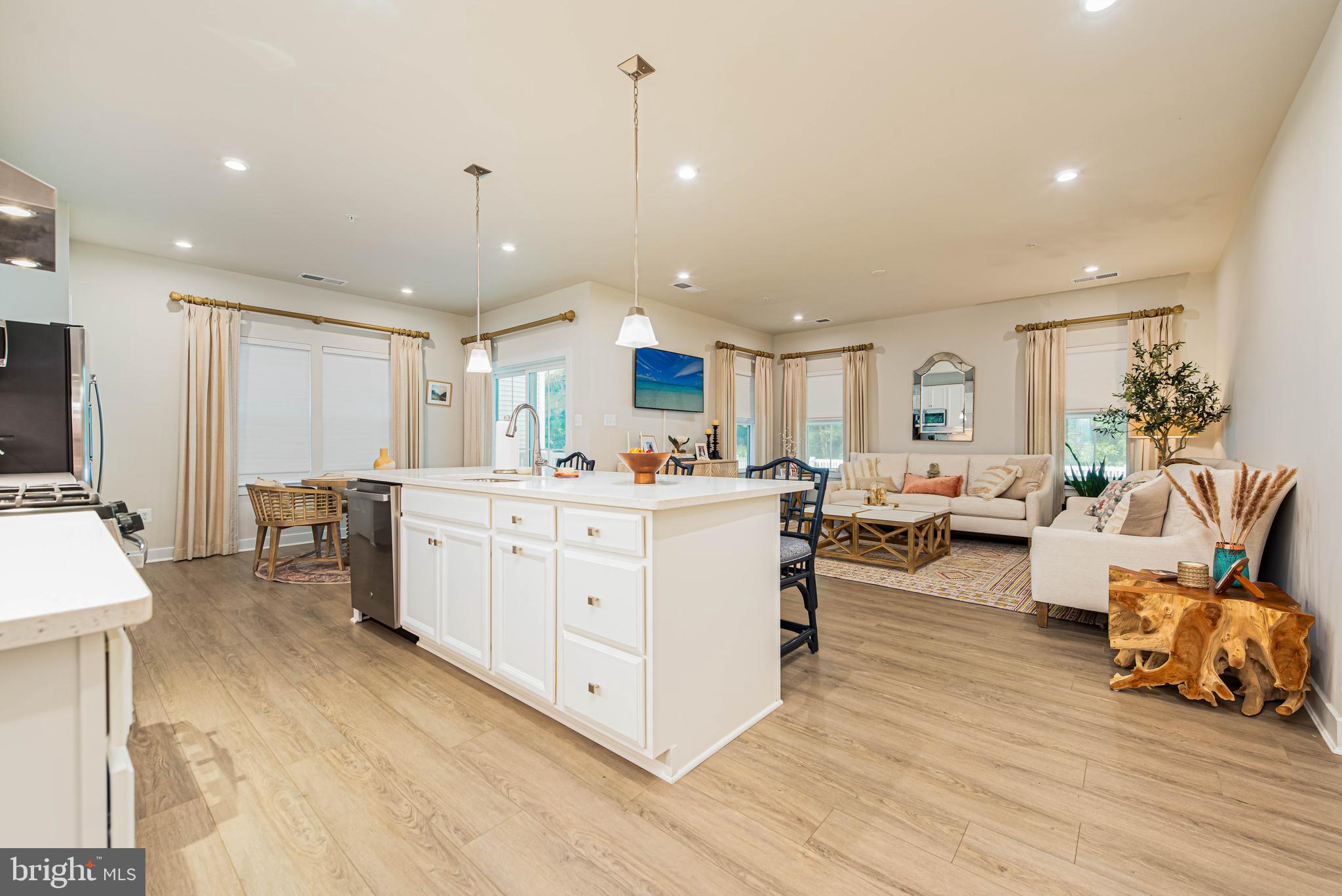 12115 Snug Harbor Road Berlin, MD 21811 - Photo 5 of 46 a large room with lots of furniture and a wooden floors