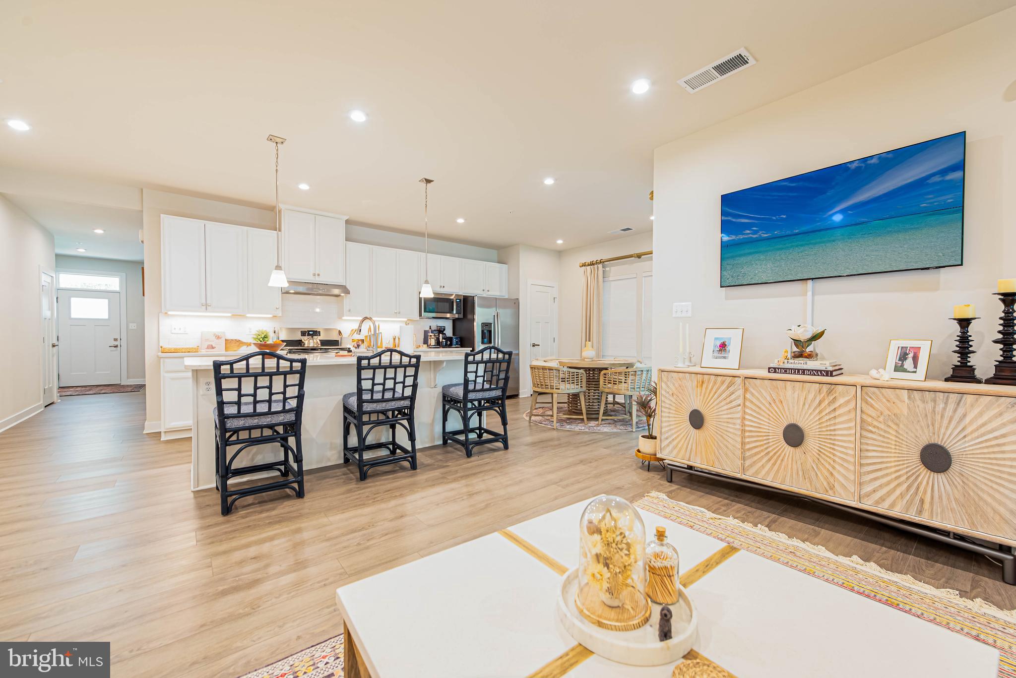 12115 Snug Harbor Road Berlin, MD 21811 - Photo 9 of 46 a living room with stainless steel appliances furniture and a wooden floor