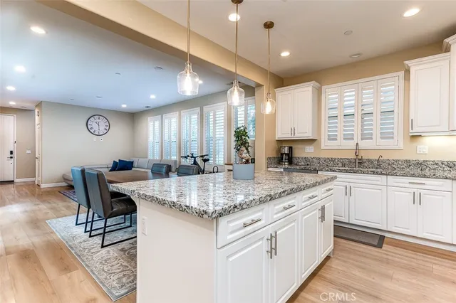 a kitchen with center island table and chairs in it