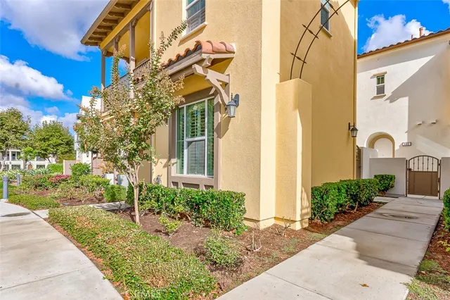a view of a house with a yard and plants
