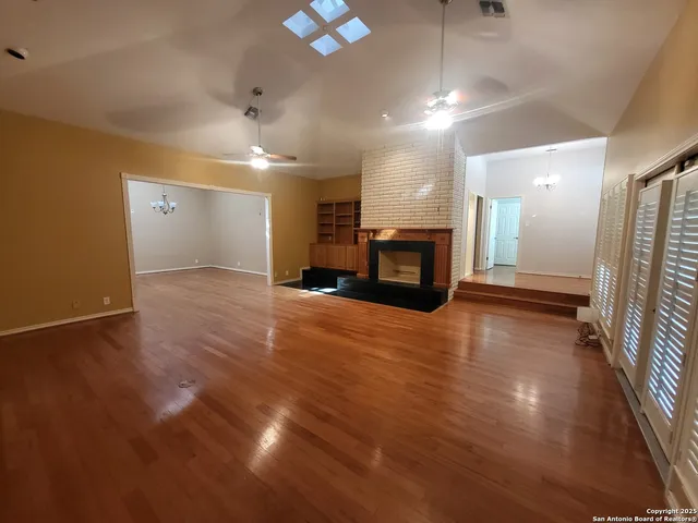 a view of a room with gym equipment and a large window