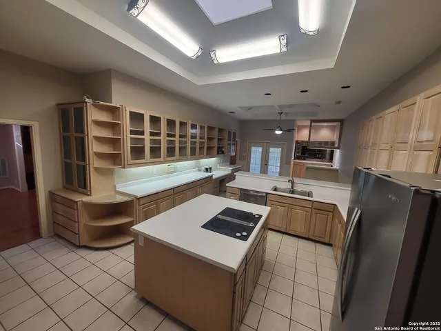 a kitchen with a sink and cabinets