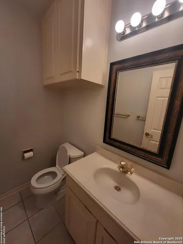 a view of a room with shelves and wooden floor