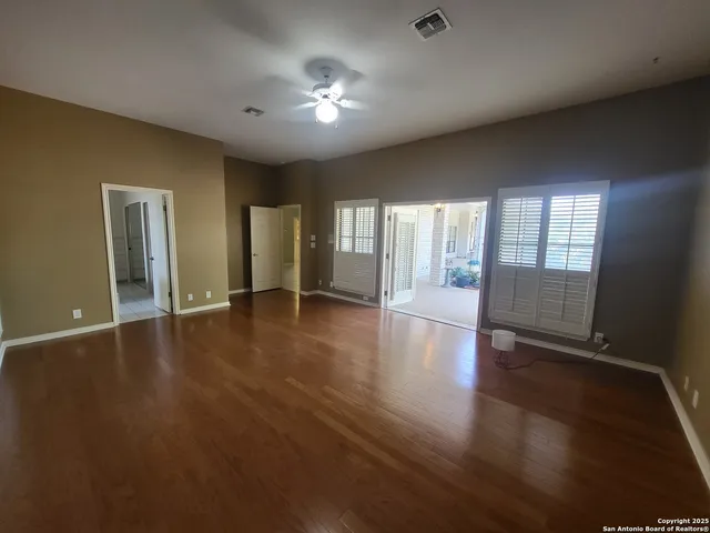 a view of a house with porch and garden