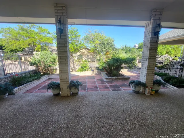 a sitting area with chairs and table in balcony