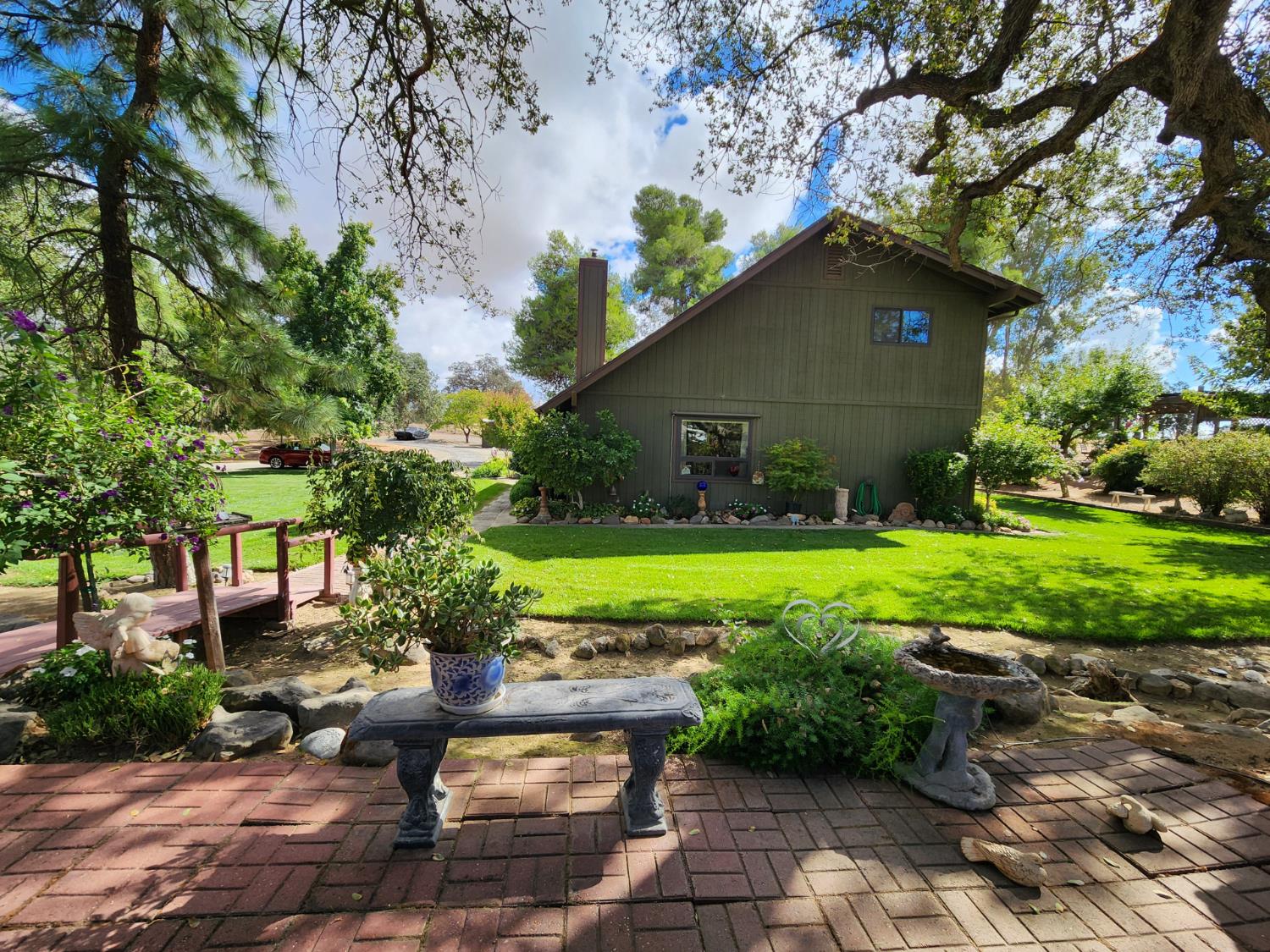 22266 Frontier Road Clovis, CA 93619 - Photo 11 of 61 a view of a table and chairs in backyard of the house