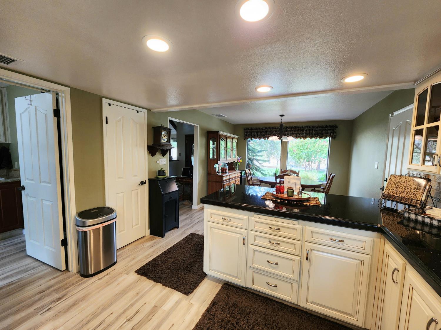 22266 Frontier Road Clovis, CA 93619 - Photo 22 of 61 a kitchen with stainless steel appliances kitchen island granite countertop a refrigerator and a sink