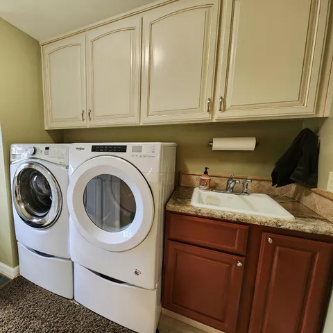 a view of a backyard with sitting area
