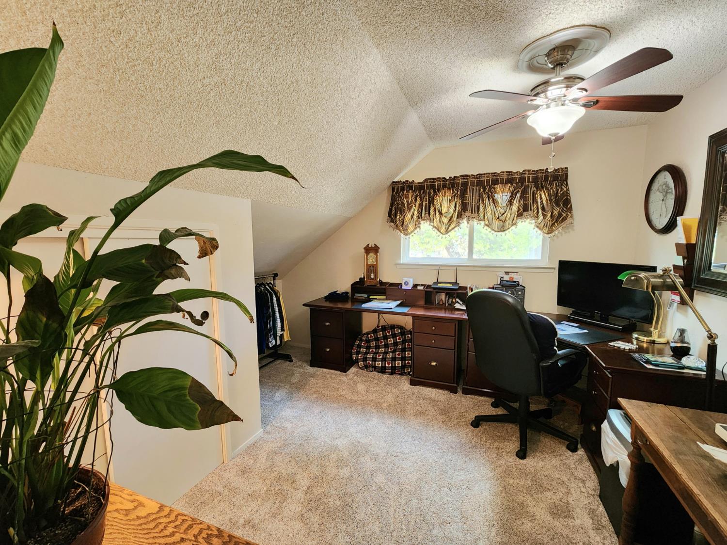 22266 Frontier Road Clovis, CA 93619 - Photo 31 of 61 a living room with a couch and a flat screen tv