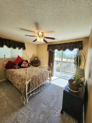 a view of a backyard with sitting area