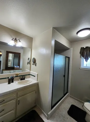 a view of a lake with a bench in the background