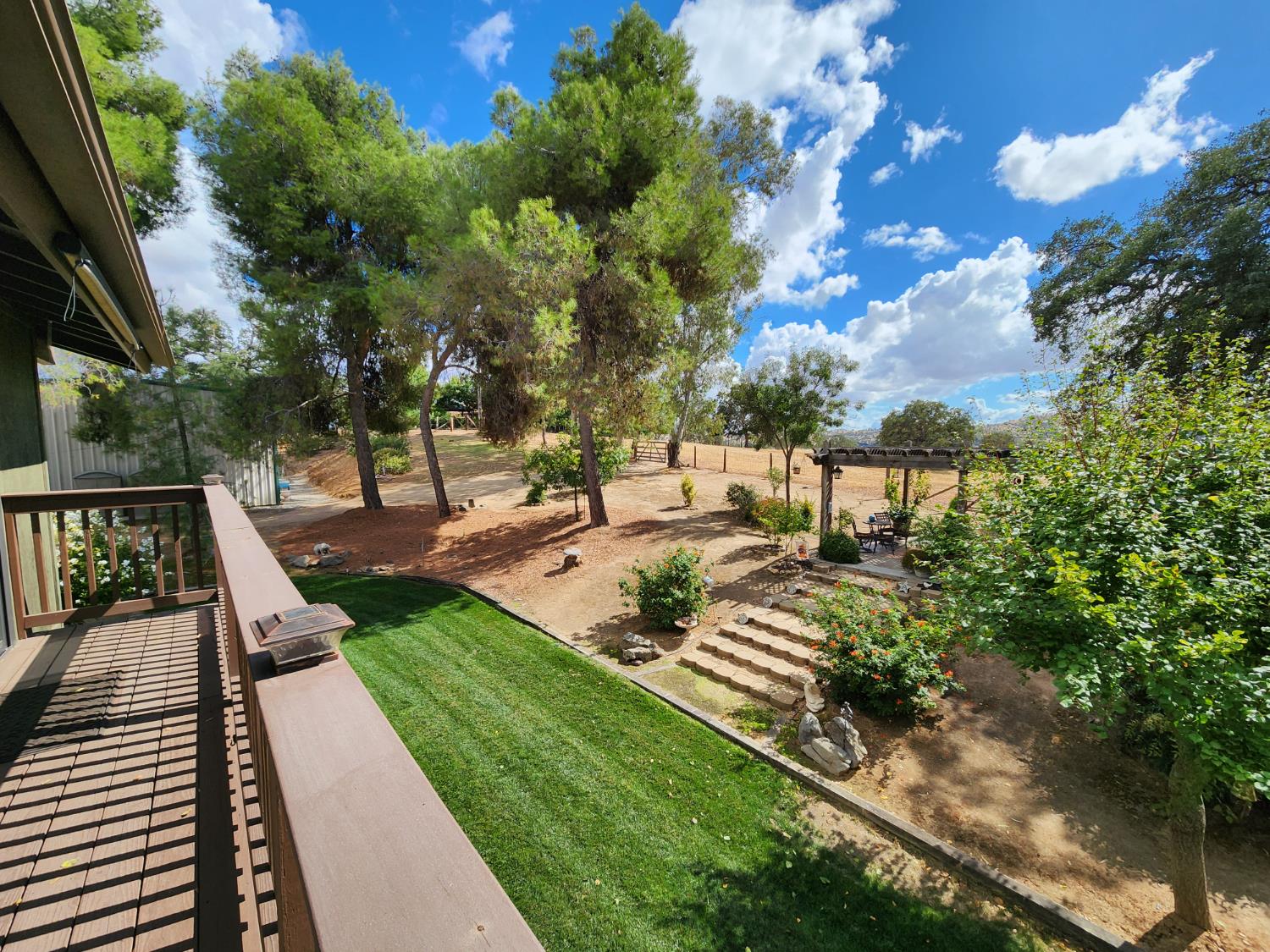 22266 Frontier Road Clovis, CA 93619 - Photo 35 of 61 a view of a backyard with sitting area