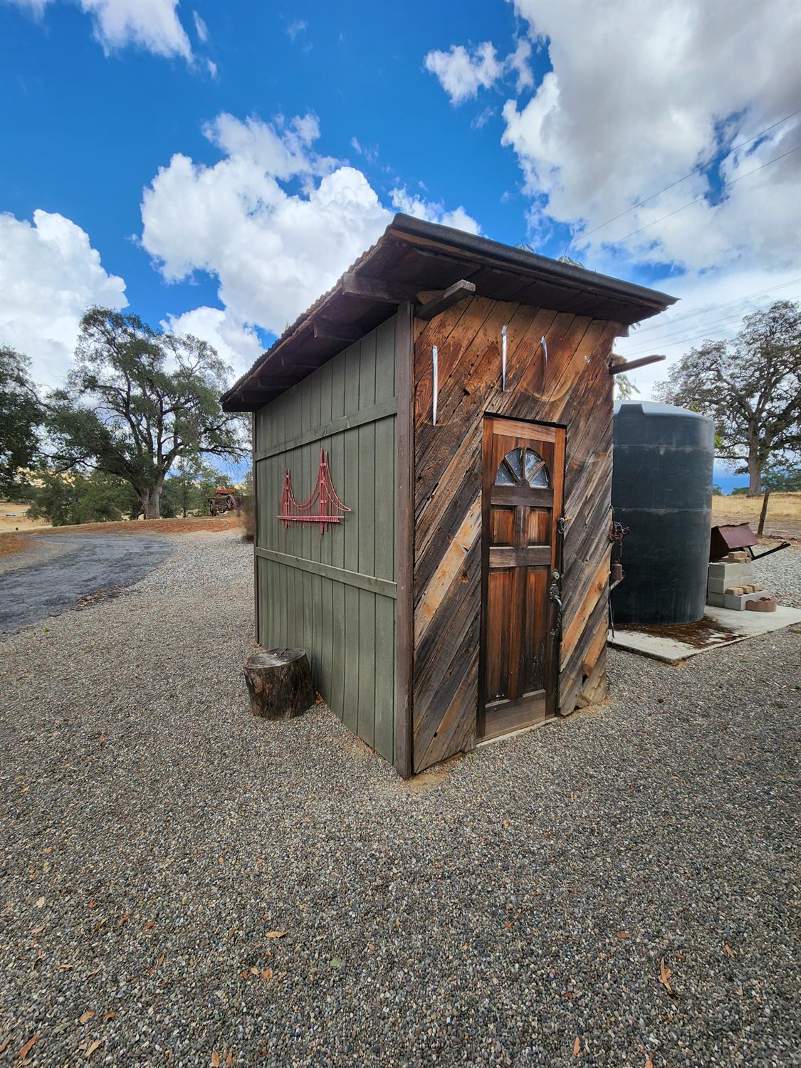 22266 Frontier Road Clovis, CA 93619 - Photo 41 of 61 a view of a house with a yard and garage