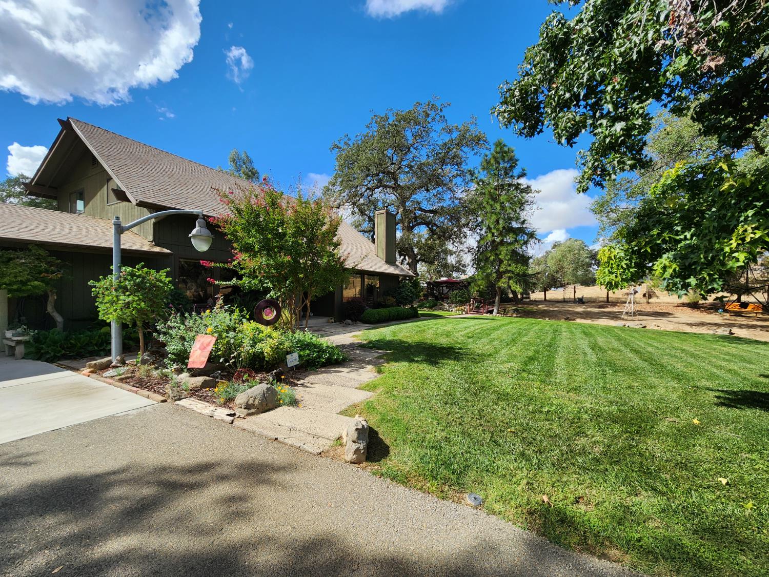 22266 Frontier Road Clovis, CA 93619 - Photo 9 of 61 a view of a garden with plants