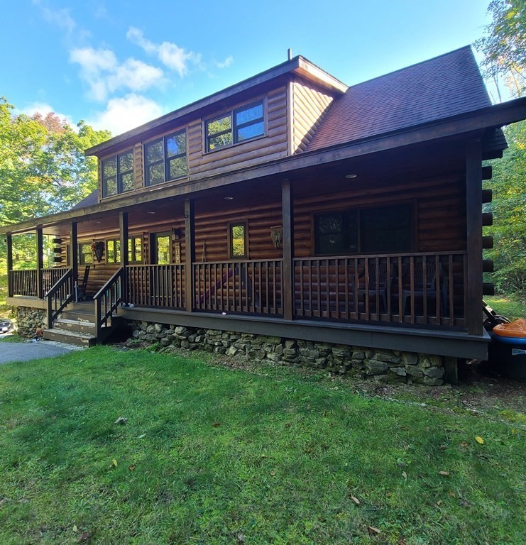 118 Town Farm Road Brookfield, MA 01506 - Photo 1 of 26 a front view of a house with garden