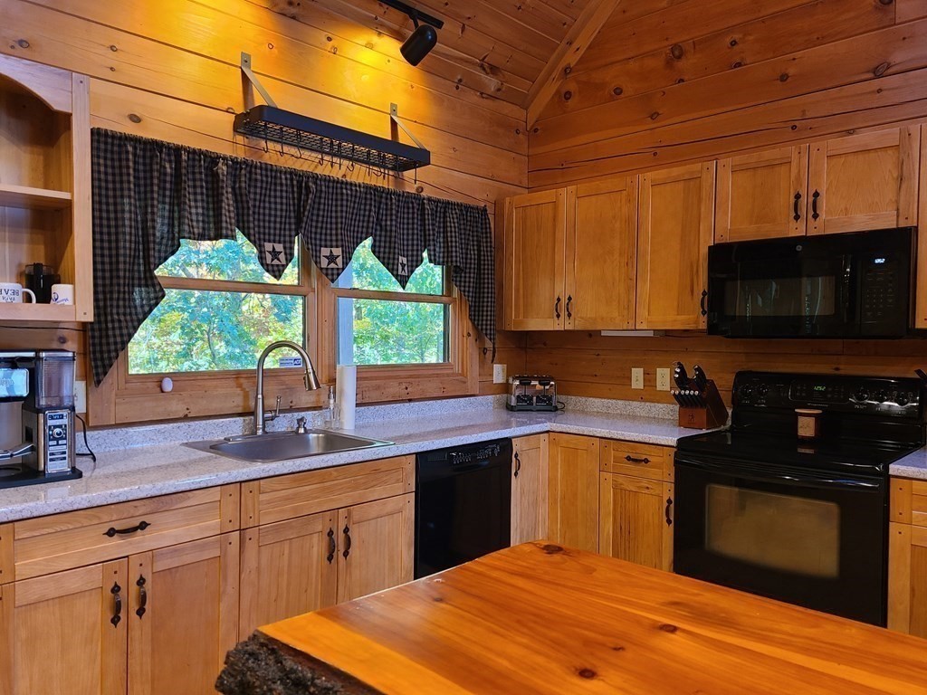 118 Town Farm Road Brookfield, MA 01506 - Photo 8 of 26 a kitchen with stainless steel appliances a sink dishwasher stove and microwave