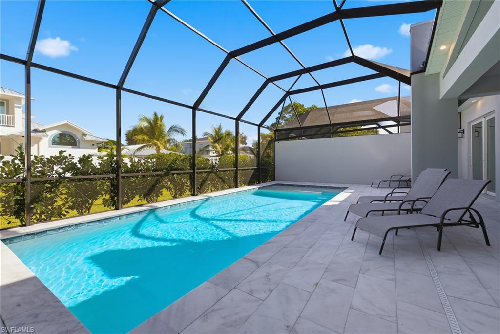 711 91st Avenue North Naples, FL 34108 - Photo 25 of 29 a swimming pool with yard