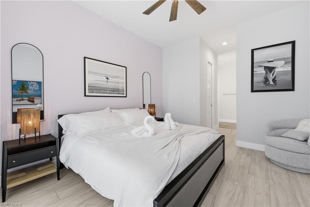 711 91st Avenue North Naples, FL 34108 - Photo 9 of 29 a large white bed in a white room