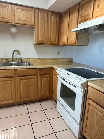 a view of a kitchen with washer and dryer