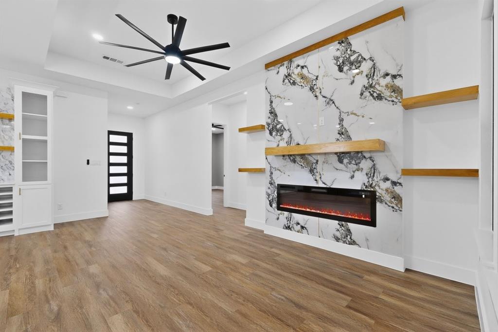 4737 Pine Ridge Court Athens, TX 75752 - Photo 6 of 26 wooden floor with chandelier fan and wooden floor