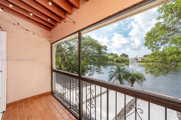a view of a balcony with wooden floor