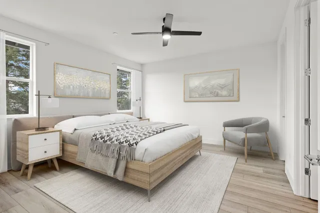 a bedroom with a bed and a chair