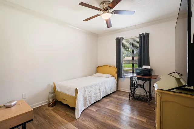 a view of a house with a backyard porch and sitting area