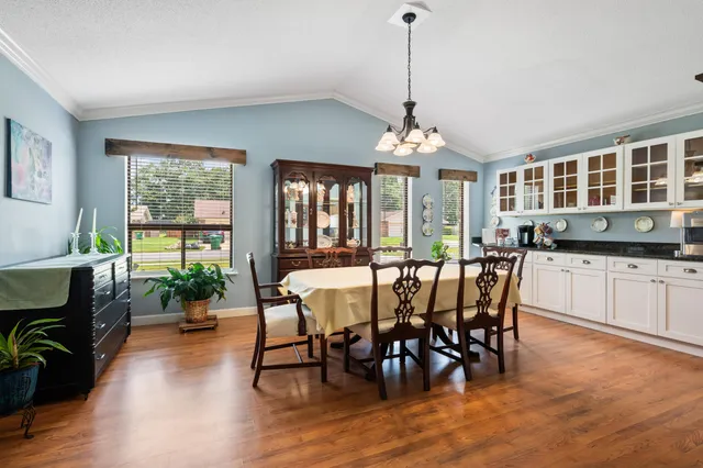 a view of a dining room with furniture window and outside view